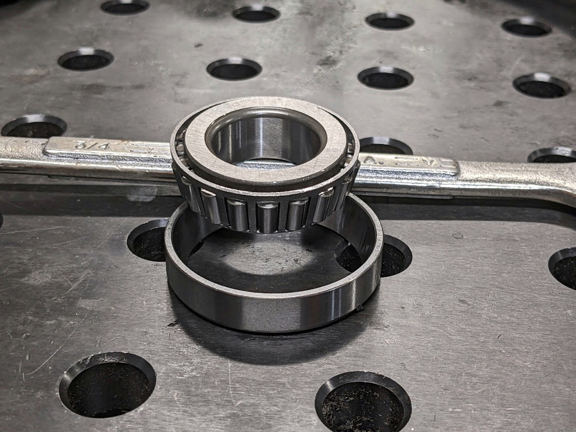 We use 2 sets of automotive taper roller wheel bearings in each swing out for super long life and nice action.