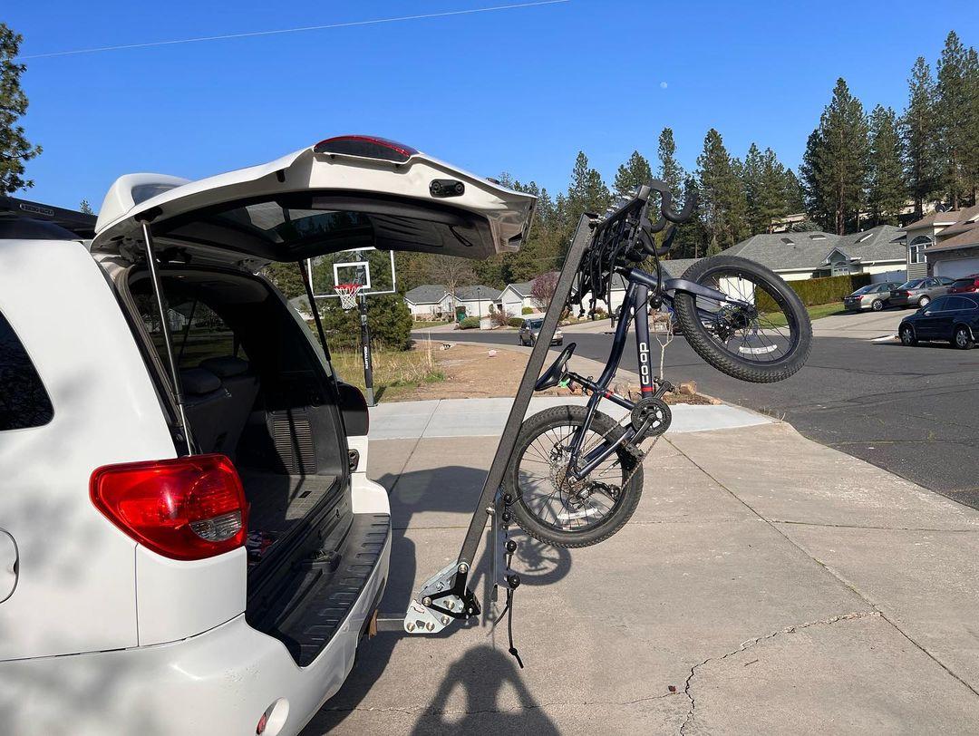 Tiltable bike clearance rack