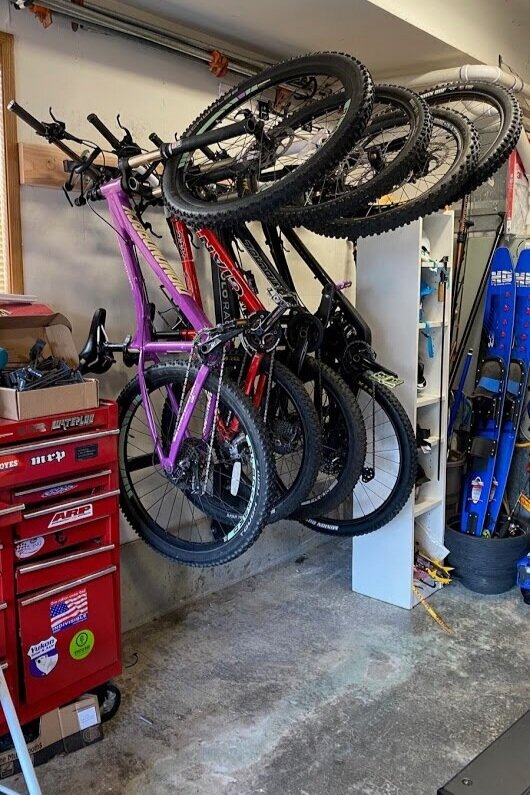 The lolo rack fits great in your garage and takes up much less space than a wheel bucket style rack. 